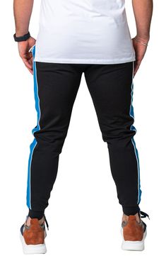 Athleisure is reinvented in these comfy joggers that leave others in the dust with supersoft fleece, bold side stripes and a skinny fit. Elastic/drawstring waist Front scoop pockets 92% cotton, 8% elastane Hand wash, dry flat Made in Turkey Sporty Streetwear Joggers With Contrast Stripes, Blue Sweatpants With Three Stripes For Streetwear, Casual Cotton Joggers With Contrast Stripes, Blue Sporty Sweatpants With Three Stripes Branding, Sporty Blue Sweatpants With Three Stripes Branding, Sporty Blue Joggers With Three Stripes Branding, Sporty Sweatpants With Contrast Stripes For Streetwear, Cotton Sweatpants With Three Stripes For Jogging, Blue Sports Sweatpants With Elastic Side Panels