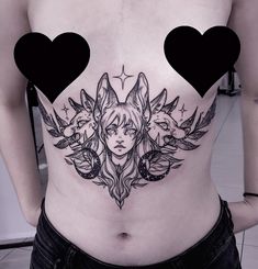 a woman with two heart shaped tattoos on her stomach