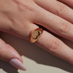 The timeless Girlfriend Signet Ring combines classic sophistication with playful spirit. The curved thick band is molded to a statement heart shape, which offers a refined aesthetic sure to be admired. The 18-karat gold filled ring is electroplate finished to provide a luxe and long-lasting finish, able to withstand water and more! Nickel And Suede, Refined Aesthetic, Heart Shaped Jewelry, Ring Shapes, Gold Filled Ring, Signet Ring, Heart Shape, Elegant Design, Gold Filled