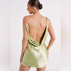 the back of a woman in a short dress