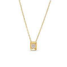 This Emerald Gold Frame Solitaire Pendant Necklace features an emerald cut diamond totaling approximately 0.21 carats framed in 18K yellow gold. 14k Gold Emerald Cut Solitaire Necklace, Timeless 14k Gold Emerald Cut Solitaire Necklace, Emerald Cut Solitaire Necklace In 14k Gold, Gold Solitaire Necklace With Emerald-cut Diamond Accents, Gold Solitaire Necklace With Emerald Cut Diamond Accents, 14k Gold Necklace With Emerald Cut Diamond Accents, Timeless 14k Gold Emerald-cut Necklace, Luxury Gold Necklace With Radiant Cut, Gold Radiant Cut Diamond Necklace