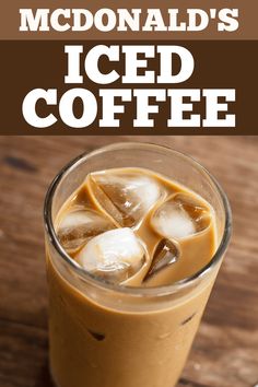 iced coffee in a glass with ice cubes on the rim and text that reads mcdonald's iced coffee