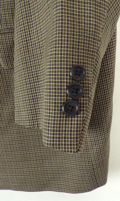 "-Description- >brown & blue checkered men's blazer/sport coat >three button front >three buttons on the cuffs >lined >one open and two sewn closed pockets on the front >size 42 >great check! >condition: great >color(s): brown, blue >brand: biella >care: dry clean -Measurements- >size: 42 ✩ all measurements are taken with the item laying flat & some sizes are estimates so please check measurements ✩ chest: 46\" / 117cm length: 31\" / 78cm shoulder to s Brown Button-up Sport Coat For Business Casual, Tailored Brown Button-up Sport Coat, Tailored Brown Sport Coat With Button-up, Tailored Brown Sport Coat With Button-up Design, Plaid Business Outerwear With Buttons, Classic Plaid Blazer With Buttons, Fitted Single Button Plaid Outerwear, Plaid Blazer With Button Closure For Business, Preppy Formal