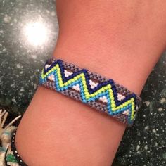 a close up of a person wearing a bracelet