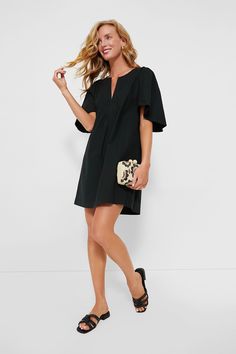 The Black Finley Flutter Sleeve Dress is the flirty frock your wardrobe is missing! In a seasonless color, this mini has oversized flutter sleeves and a V-neckline. Pair with espadrilles and a tote for everything from work to brunch. Notched neckline Oversized flutter sleeves Side seam pockets Mini silhouette Boxy fit Material: 100% Cotton Care: Hand wash cold, hang to dry Chic Flutter Sleeve Mini Dress For Brunch, Chic Spring Mini Dress With Flutter Sleeves, Casual Mini Dress With Flutter Sleeves For Brunch, Black Flutter Sleeve Dress For Spring, Chic Flutter Sleeve Mini Dress For Beach, Casual Flutter Sleeve Mini Dress For Day Out, Chic Mini Dress With Flutter Sleeves For Day Out, Casual Mini Dress With Flutter Sleeves For Day Out, Spring Workwear Mini Dress With Ruffle Sleeves