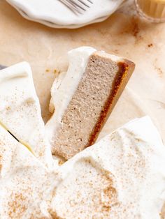 a piece of cake sitting on top of a plate next to a fork and knife