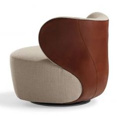 a modern chair with a curved back and leather upholstered on the seat is shown