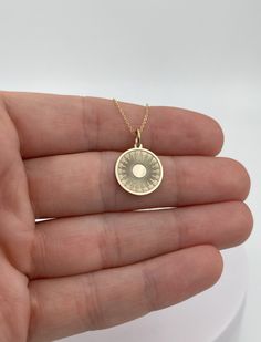 14k Solid Gold Sun Necklace, Personalized Sun Pendant, Sunshine Necklace, 14k Real Gold Sun Pendant **Photos and video are both for the 14mm diameter option**  Pendant Description : Pendant Material: 14k Solid Gold Metal Stamp: 14k Pendant Thickness: 0.5mm -Options for pendant diameter --14mm / 0.55 inches --18mm / 0.705 inches (diameter of Dime) -Inner diameter of jump ring : 4mm Chain description: Chain Material : 14k Solid Gold Chain Thickness: 0.7 mm -Chain length: --40cm /15,7 inches --45cm 14k Gold Charm Necklaces, 14k White Gold Charm Necklace With Round Pendant, 14k White Gold Round Pendant Charm Necklace, 14k Gold Hallmarked Round Pendant Charm Necklace, Yellow Gold Charm Necklaces With Polished Finish, Yellow Gold Sterling Silver Charm Necklaces, Polished Finish Yellow Gold Charm Necklace, 14k Gold Charm Necklace With Polished Finish, 14k Gold Round Disc Necklace With Charms