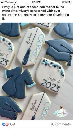 decorated cookies with graduation caps and tassels are displayed on a white tablecloth