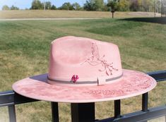 Elevate your style with our stunning pink hat, featuring an enchanting hummingbird nestled among delicate flowers. This eye-catching design is perfect for adding a pop of color to any outfit, whether you're enjoying a sunny day out or adding flair to your everyday look. Made with high-quality materials for both comfort and durability, this hat isn't just a fashion statement; it's a celebration of nature's beauty. Stand out and let your personality shine with this unique accessory--grab yours today and embrace the pretty in pink! Color:  Blush Pink Size: Medium fits 7 1/8" - 7 1/4" Pink Bohemian Sun Hat For Kentucky Derby, Bohemian Pink Sun Hat For Kentucky Derby, Feminine Adjustable Hat With Short Brim, Feminine Adjustable Brimmed Hat, Pink Summer Hats For Kentucky Derby, Pink Summer Hat For Kentucky Derby, Pink Feminine Hat With Adjustable Fit, Pink Bohemian Fedora For Spring, Feminine Pink Adjustable Hat