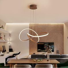 a modern dining room with wooden table and green chairs