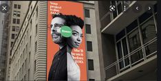 a large billboard on the side of a building with an image of a man and woman