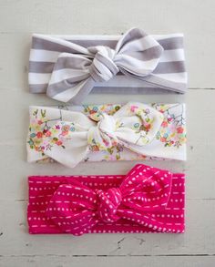 three headbands with bows on top of them