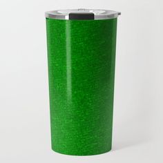 a green travel mug with a black lid is shown on a white background the cup has a metal rim