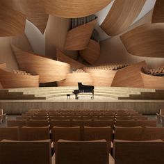 an empty concert hall with a piano in the foreground and rows of seats to the side