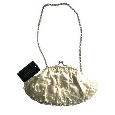 Milami New York Ivory Pearl Evening Bag. Elegant And Absolutely Beautiful Evening Bag. Soft Satin Fabric Accented With Pearls On Front. Silver Hardware, Chain Strap That Can Be Easily Tucked In And Carried As A Clutch Purse. Snap Closure. Lined. Card Slot Inside. Great For Dinners, Cocktails Or Any Special Occasion. Sku:427 Color: Ivory Size: Small Approx: 9"W X 4.75"H, 9"Strap Drop Condition: Nwt. No Issues Material:Satin Check Out My Closet! Lots Of Great Pieces Smoke & Pet Free Home Cream Pouch Bag For Party, Feminine Cream Wedding Bags, Feminine Cream Bags For Wedding, Cream Clutch For Events, Cream Clutch Bag For Events, Cream Evening Clutch Bag, Cream Pouch Shoulder Bag For Party, Feminine White Clutch Bag, Cream Clutch Shoulder Bag For Party