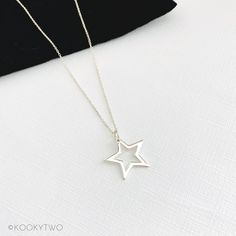 "Gorgeous shiny sterling silver open star necklace. This lovely simple star charm is available on a choice of sterling silver chains and lengths. A stylish necklace perfect for everyday styling, to compliment your look. Select a length to suit your style, and wear solo or layer with other necklaces. Lovely necklace you'll love to wear or love to give. ☆ Select chain style and length when adding to basket. ☆ P R O D U C T ∙ D E T A I L S  ∙ Metal: 925 Sterling Silver  ∙ Star approximately 20mm  ∙ Necklace comes with two number charms  ∙ Spring clasp fastening  ∙ Hypoallergenic ∙ Nickel and lead free  ∙ Gift-ready in our stylish white KookyTwo box  ∙ Handmade by us in our UK studio ☆ C H A I N ∙ L E N G T H  Length: Measurement from end to end including the clasp.  ∙ Trace Chain:  18\"   ∙ C Minimalist Star Necklace For Everyday, Simple Star-shaped Jewelry With Star Charm, Sterling Silver Star Charm Necklace For Everyday, Everyday Sterling Silver Star Charm Necklace, Minimalist Silver Star Charm Necklace, Minimalist Silver Star Necklaces, Sterling Silver Star Jewelry For Everyday, Silver Minimalist Star Necklace, Everyday Sterling Silver Star Jewelry