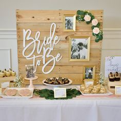 a table topped with pictures and desserts next to a sign that says bride to be