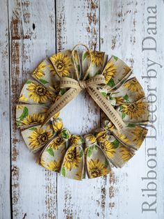 a sunflower print fabric wreath on a white wooden background