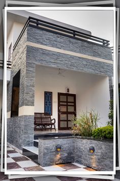 a house that is made out of stone and has a bench on the front porch