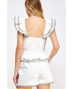 Contrast embroidered stitching blouse in stretch poplin fabric. This sleeveless style features smocking at the back, a classic V-neck, an elasticated waist, elasticated double-ruffled shoulder detail, and button embellishment at the front. It can be made into a set with Penny Poplin Shorts. 65% Cotton | 30% Nylon | 5% Spandex Poplin Shorts, Poplin Top, Poplin Fabric, Smocking, Penny, Stitching, Off White, Spandex, V Neck