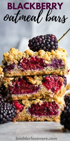 blackberry oatmeal bars stacked on top of each other with berries and blackberries