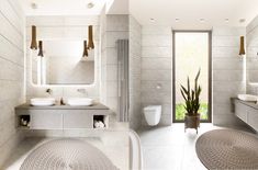 a modern bathroom with two sinks and mirrors