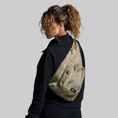 Small but mighty, this On the Go Sling Bag will quickly become your go-to bag for the gym, travel, hiking, day trips to the lake, or anything else that gets you out of the house. With one large main compartment and three smaller zipper pockets, you can easily store a change of clothes, water bottle, everyday essentials, resistance bands, and so much more. Plus, the adjustable straps provide a comfortable fit for nearly everyone. Hiking Water Bottle, Small But Mighty, Travel Hiking, Resistance Bands, Everyday Essentials, Sling Bag, Day Trips, Everyday Essentials Products, Zipper Pocket