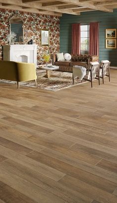 a living room with wood flooring and furniture in the background, including a fireplace