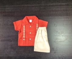 So Cute Manta Guayabera Embroidered Mexican Baby/ Toddler Shirt and Shorts Outfit Different Sizes Shirt color: Spice Orange Shorts: Beige Embroidered Short Sleeve Summer Sets, Festive Short Sleeve Sets For Summer, Summer Embroidered Short Sleeve Sets, Embroidered Cotton Short Sleeve Sets, Embroidered Cotton Sets With Short Sleeves, Casual Embroidered Short Sleeve Set, Summer Embroidered Cotton Pant Set, Embroidered Red Summer Sets, Festive Sets With Embroidered Short Sleeve