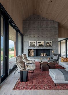 a living room filled with furniture and a fire place next to a wall mounted fireplace