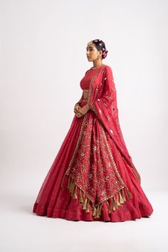 Intricately hand embroidered high neck blouse clubbed with a silk organza lehenga and a hand-cut mirror border dupatta.From Vvani Vats Rang's collection.DELIVERY TIMEPlease allow 8-12 weeks for your outfit to arrive.FABRIC DETAILSOrganza, Georgette, Silk BlendProfessional cleaning only. Plain Lehenga, Vani Vats, Heavy Lehenga, Mirror Border, Heavy Dupatta, Lehenga Dupatta, Organza Lehenga, Couple Wedding Dress, Desi Wear