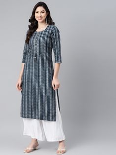 This Blue  Stripe Print Straight Kurta from Piroh exhibits tassels on placket, coconut buttons and off white kantha detail on neck and sleeves along with Round Neck & 3/4th Sleeves. Tailored from Cotton. Product Length: 46 Inches. Description Size - Measuring Unit  :  Regular Size                                 :    ( S, M, L, XL, XXL )  Shape Type                    :     Straight Length Type                   :       Calf Length Color                                :      Blue Ideal For Cotton Straight Kurta With Tassels, Traditional Cotton Kurta With Back Tassel Tie-up, Pure Cotton Dress, Casual Kurti, Kurta Patterns, Long Kurta, Straight Kurta, Dress For Women, Blue Fabric