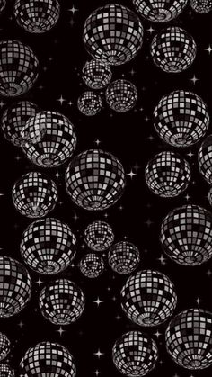 black and white disco balls with stars in the background