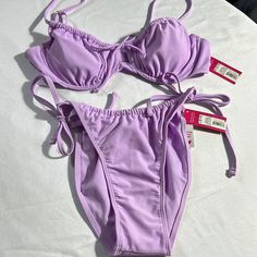 This Swimsuit Is New With The Tags Still On It So Please Read The Tags. I’m Also Including A Blue Top Which Is The Same Size As The Purple Top The Bottoms Are A Little Smaller So If You Need Measurements Please Let Me Know. I Thank You For Looking In My Closet! Purple Lined Swimwear For Beach Season, Purple Lined Swimwear For Spring, Lavender Swimwear For Beach Season, Trendy Purple Swimwear For Poolside, Lavender Beachwear Swimwear For Sunbathing, Lavender Swimwear For Poolside And Beach Season, Spring Purple Lined Swimwear, Trendy Purple Swimwear For Sunbathing, Lavender Beachwear Swimwear For Beach Season