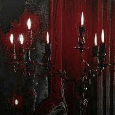 a painting of a red wall with candles in it