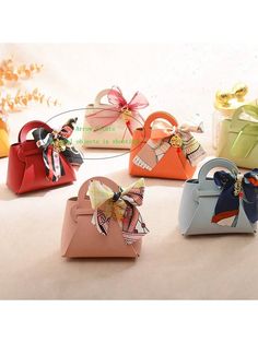 several small purses with bows on them