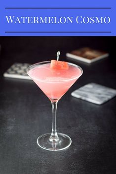 a pink drink sitting on top of a table