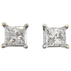 Classic diamond studs. 14 Karat Princess-Cut Diamond Earrings. Four prong set in white gold baskets, the diamonds measure 4.58 x 4.66mm and 4.33 x 4.64mm for a approximate weight of 1.00ctw. The diamonds are I1 (G.I.A.) in clarity and G-H (G.I.A.) in color. These dazzling earrings have a post and push back. Gold Baskets, Princess Cut Diamond Earrings, Vera Wang Jewelry, Gold Flower Earrings, Round Diamond Earrings, Vintage Stud Earrings, Dazzling Earrings, Diamond Earrings Studs Round, Stud Earrings Unique