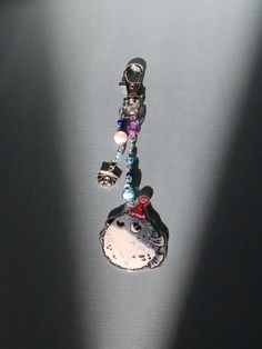 a key chain with charms attached to it