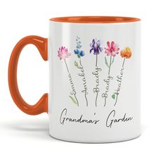 an orange and white coffee mug with the words grandma's garden printed on it