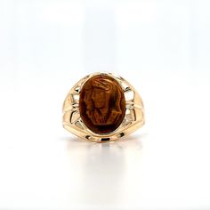 Circa 1970, a 10k yellow gold and double tiger-eye cameo ring, finger size 11.75. This ring is 19mm at the top and features a 15 x 11.5mm tiger-eye left facing double headed conquistador cameo. There are a few chips from wear around the outside edges of this cameo. Stamped 10k and hallmarked JU. Weight is 6.3 grams. Condition is good except for chips around cameo. Thanks for looking.    ERA - Circa 1970, Vintage METAL / MATERIAL - 10k yellow gold MARKINGS  - Stamped 10k and hallmarked JU. CONDITION - The overall condition  is good except for chips around cameo. A true representation of 1970s-era jewelry! SIZE / MEASUREMENTS - finger size 11.75. This ring is 19mm at the top and features a 15 x 11.5mm tiger-eye left facing double headed conquistador cameo. Weight is 6.3 grams.  VINTAGE/ANTIQ Eye Markings, Gold Tiger Eye, Cameo Ring, Tigers Eye, Ring Finger, Metal Material, Antique Items, Rings Statement, Tiger Eye