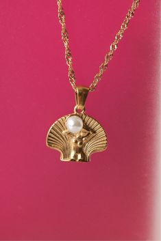 The Venus Necklace boasts a feminine aura, complete with a pearly seashell pendant. Embrace your inner beauty with this unique piece! Product Details Size: 40+5cm 18K Gold Plated Stainless Steel Water-Resistant HypoallergenicDurable Feminine Aura, Venus Necklace, Venus Jewelry, Venus Goddess, Venus Symbol, Sun Goddess, Seashell Pendants, Inner Beauty, Aphrodite