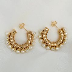 Our beautiful gold pearl hoops have an impressive appeal; they will make you look delicate, modern, and elegant on all occasions; pearls are a timeless classic because you can use them with any outfit; if you are looking to impress someone, tries giving them these pearl earrings so that they we are sure you will love them. We have several models available; check the following link to find the one that best suits you. Item Detail: Pearl Hoop Earrings Material: 18K Gold Filled -Size: 28.5 x 7.5mm Gold Hoop Earrings With Pearl Chain For Party, Party Gold Hoop Earrings With Pearl Chain, Hoop Pearl Chain Earrings, Party Hoop Pearl Earrings, Metal Hoop Pearl Earrings With Pearl Charm, Metal Hoop Earrings With Pearl Charm, Small Hoop Metal Pearl Earrings For Pierced Ears, Hoop Earrings With Pearl Chain, Hoop Earrings With Pearl Charm