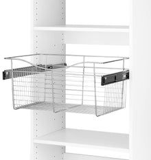 two baskets are hanging on the wall in this white pantry shelving unit with shelves