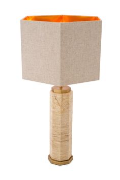 a table lamp with an orange shade on it's base and a beige linen covering over the top