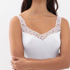 Elevate Your Basics With This Perfect White Tank. Wear This With Jeans, Leggings And A Blazed, Your Favorite Sweater Or A Skirt. The Lace Helps Upgrade Any Of Your Closet Staples. Runs True To Size. White Sleeveless Elastane Camisole, White Stretch Camisole, White Stretch Elastane Camisole, White Elastane Camisole, White Fitted Elastane Camisole, Elegant Fitted White Camisole, Elegant White Fitted Camisole, Elegant White Tops With Delicate Straps, Elegant White Seamless Top