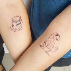 two people with tattoos on their arms and one has a small dog tattoo on the arm