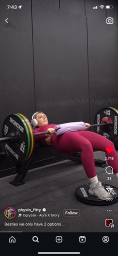 a woman is doing squats on a bench with a barbell in front of her