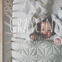 a baby laying in a crib with the caption graycn english god's blessing